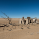 Illustration for article titled Colorful Desert Ruins Consumed by Waves of Sand